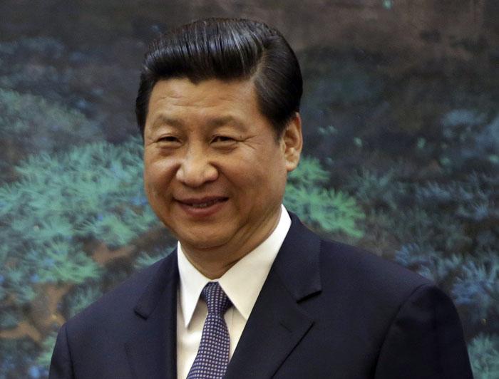 FILE - In this May 6, 2013 file phot, China's President Xi Jinping, shakes hands with his Palestinian counterpart Mahmoud Abbas, unseen, during a signing ceremony at the Great Hall of the People in Beijing, China. China's new leader Xi will confer with President Barack Obama in June in California, months earlier than their expected first meeting, as both sides seek to stem a drift in relations, troubled by issues from cyberspying to North Korea. (AP Photo/Jason Lee, Pool, File)