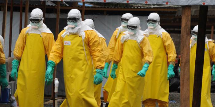 Health care workers, wearing a protective suits, leave a high-risk area at the French NGO Medecins Sans Frontieres (Doctors without borders) Elwa hospital on August 30, 2014 in Monrovia. Liberia has been hardest-hit by the Ebola virus raging through west Africa, with 624 deaths and 1,082 cases since the start of the year. AFP PHOTO / DOMINIQUE FAGET        (Photo credit should read DOMINIQUE FAGET/AFP/Getty Images)