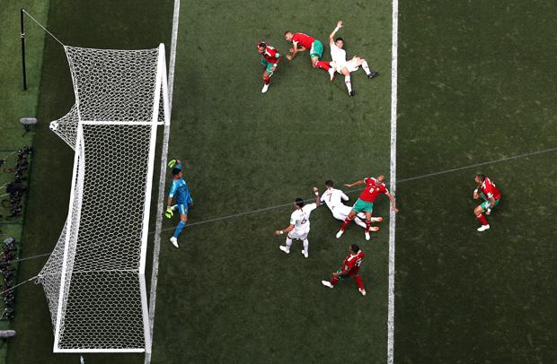 MOSCOW, RUSSIA - JUNE 20:  Cristiano Ronaldo of Portugal scores his team's first goal past Monir El Kajoui  during the 2018 FIFA World Cup Russia group B match between Portugal and Morocco at Luzhniki Stadium on June 20, 2018 in Moscow, Russia.  (Photo by Stu Forster/REMOTE/Getty Images)