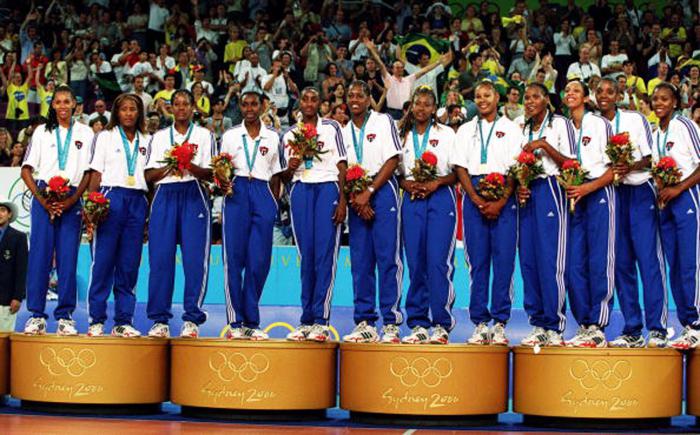 30 Sep 2000:  The Cuban womens volleyball team celebrate their gold medals after defeating Russia 3-2 in the gold medal match of the Womens Volleyball tournament held at the Sydney Entertainment Centre during the Sydney 2000 Olympic Games in Sydney, Australia. Mandatory Credit: Scott Barbour/ALLSPORT