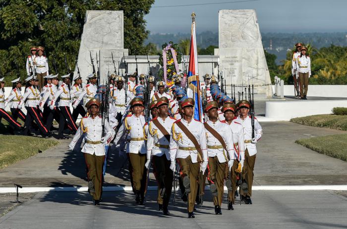 Acto Político y Ceremonia Militar en ocasión del Aniversario 123 de la caída en combate del Mayor General Antonio Maceo Grajales, Lugarteniente General del Ejército Libertador y su ayudante el Capitán Panchito Gómez Toro, y del aniversario 30 de la operación ¨Tributo¨, en el Cacahual, Presiden el miembro del Buró Político del Comité Central del Partido el general de cuerpo de ejército Álvaro López Miera, viceministro primero de las Fuerzas Armadas Revolucionarias Jefe del Estado Mayor General y Abelardo Álvarez Gil, miembro del Secretariado del Comité Central del Partido