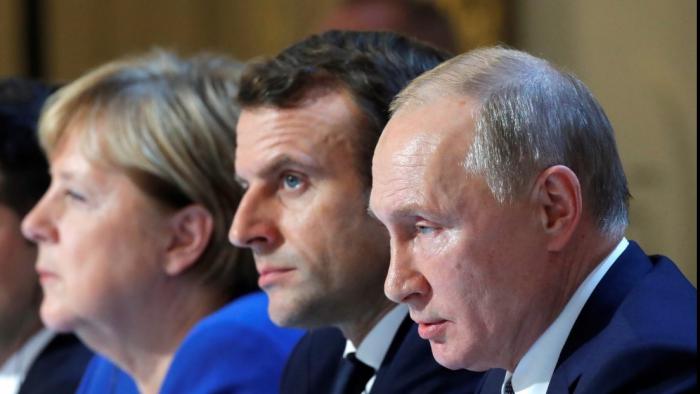 Angela Merkel, Emmanuel Macron y Vladimir Putin