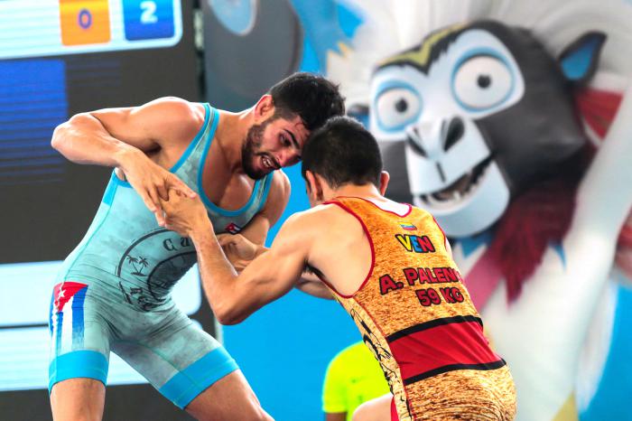 Ismael Borrero combate en la categoría 97 Kg de la Lucha Luis Orta combate en la categoría 60 Kg de la Lucha Grecorromana, en la Universidad del Atlántico,  durante los XXIII Juegos Centroamericanos y del Caribe en Barranquilla 2018, Colombia, el 29 de julio de 2018. Roberto Morejon/Periodico JIT INDER