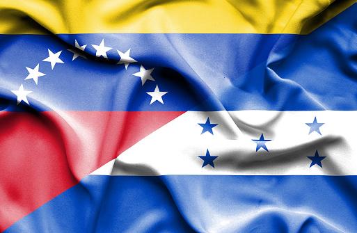 Waving flag of Honduras and Venezuela
