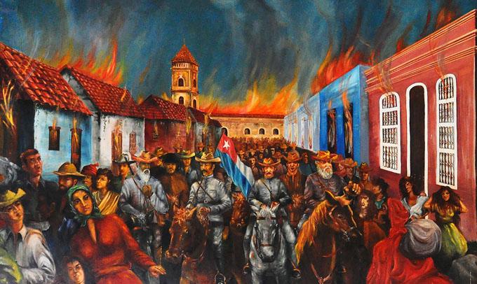 Recreación del incendio de Bayamo, hecho ocurrido el 12 de enero de 1868. La foto es un detalle de un pintura, ubicada en la sede de la Asamblea Municipal del Poder Popular en Bayamo. / Foto: Rafael Martínez Arias.